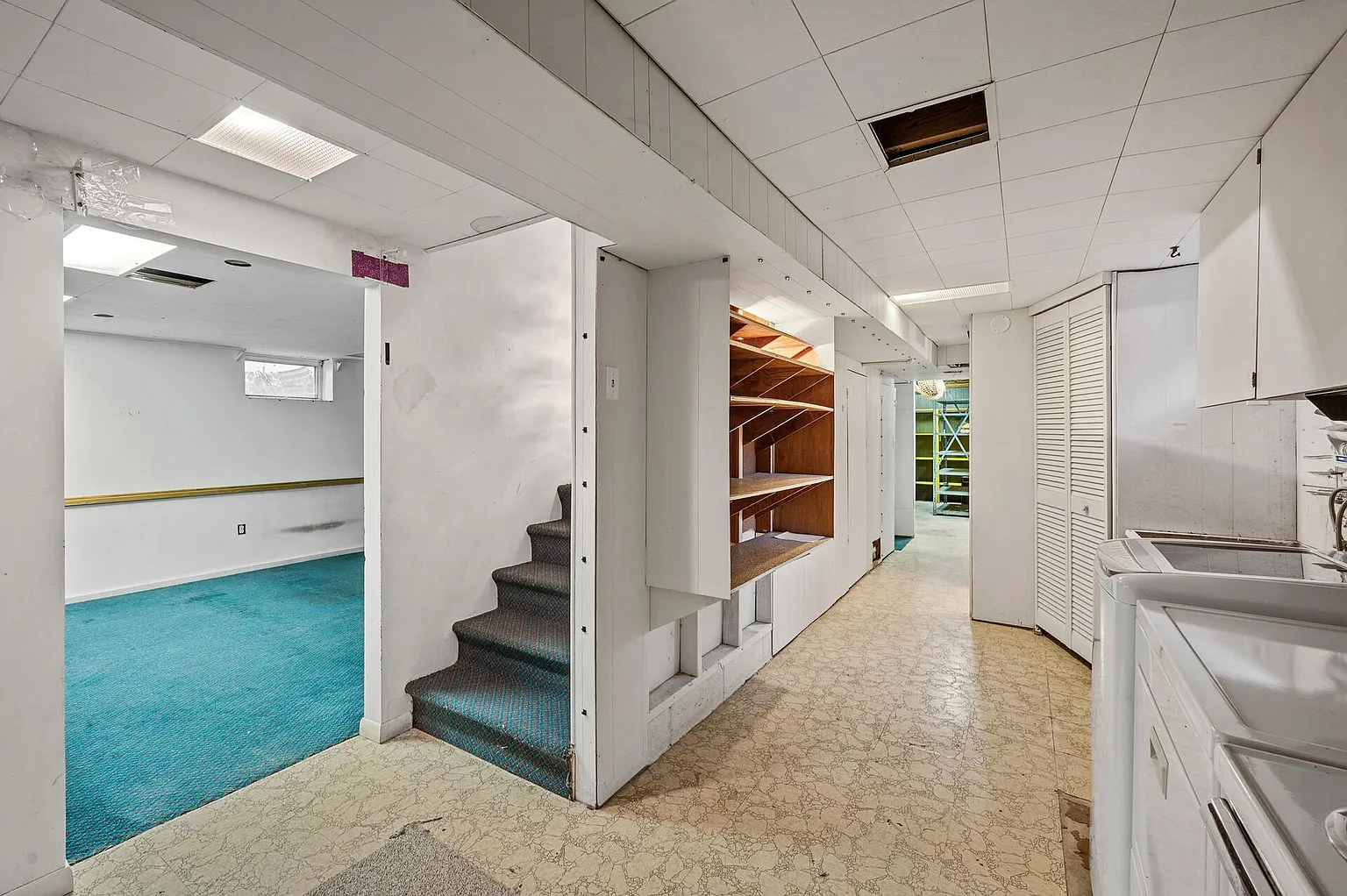 Large lower-level recreation room with a fireplace