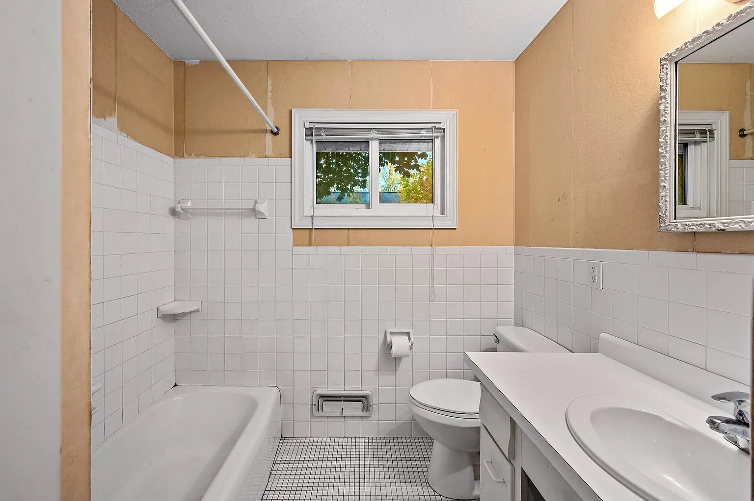 Bathroom with a tub and shower